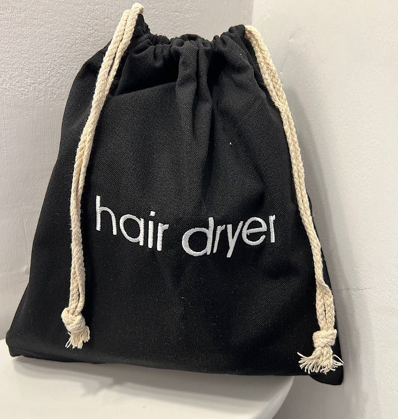Hair dryer and flat iron included in the unit