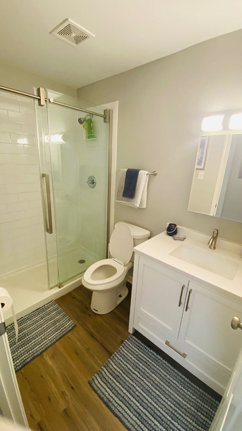 Subway tiled shower, glass shower door and updated vanity. Bathroom essential provided.