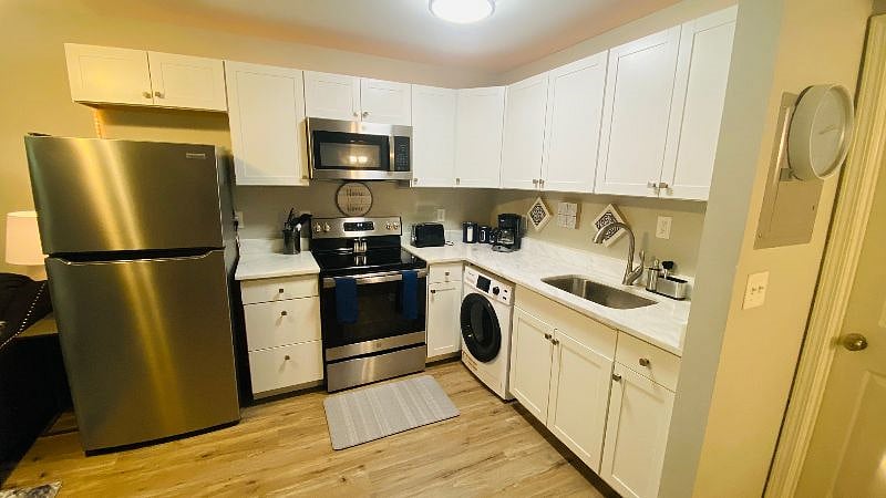 Stainless steel appliances, microwave, refrigerator and full stove with washer/dryer combo in unit!