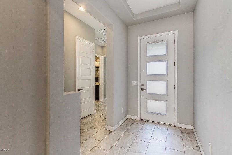 Facing the front entrance from inside you will see the bedroom and bath are to the left and at the front of the home giving you privacy