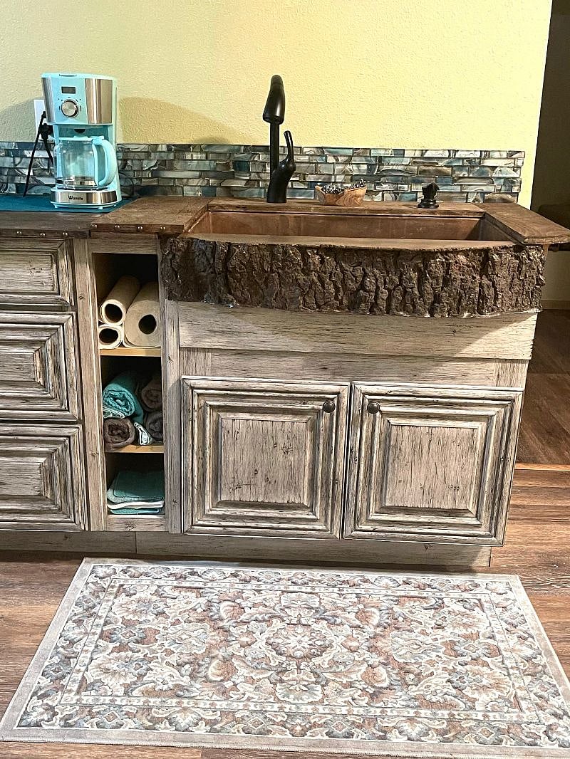 Artisan custom concrete sink made to look like a tree. 