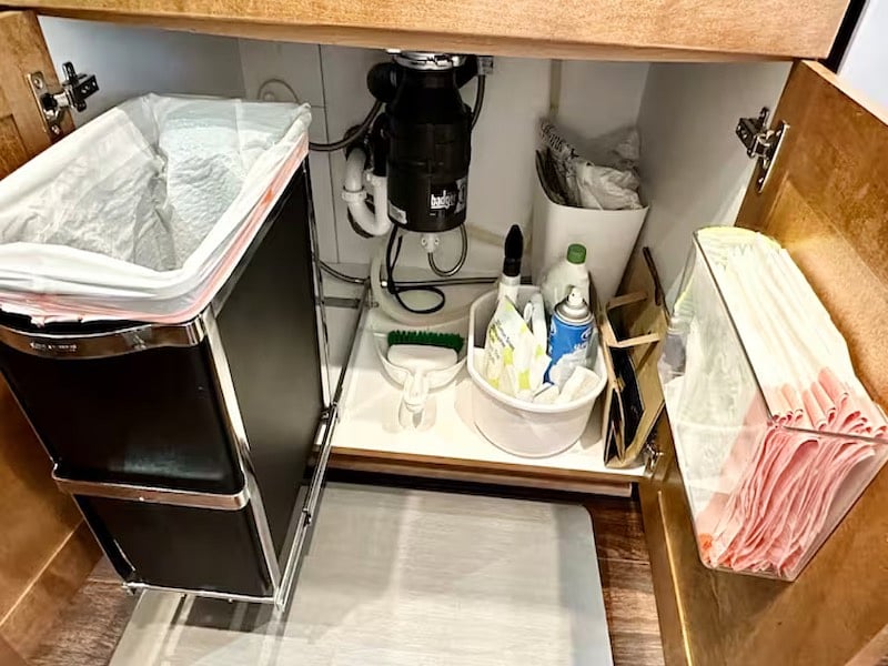Under-sink organization: trash + essentials
