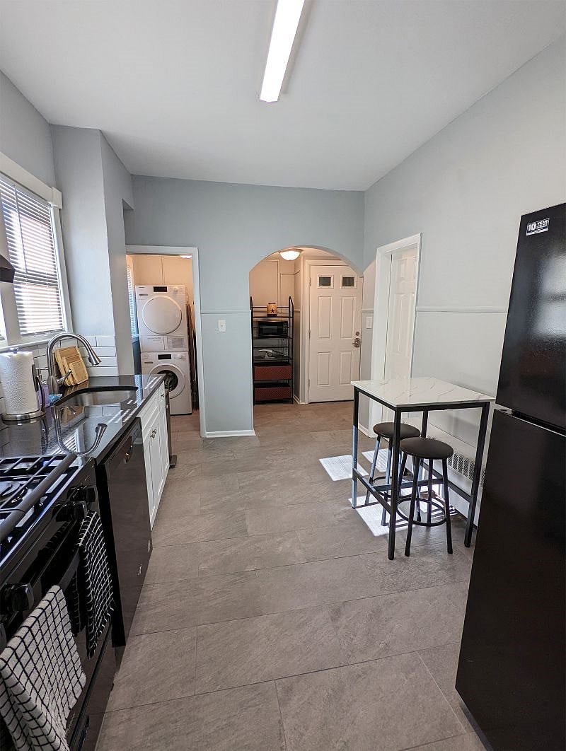 Alternate view of kitchen w/ entry to laundry room