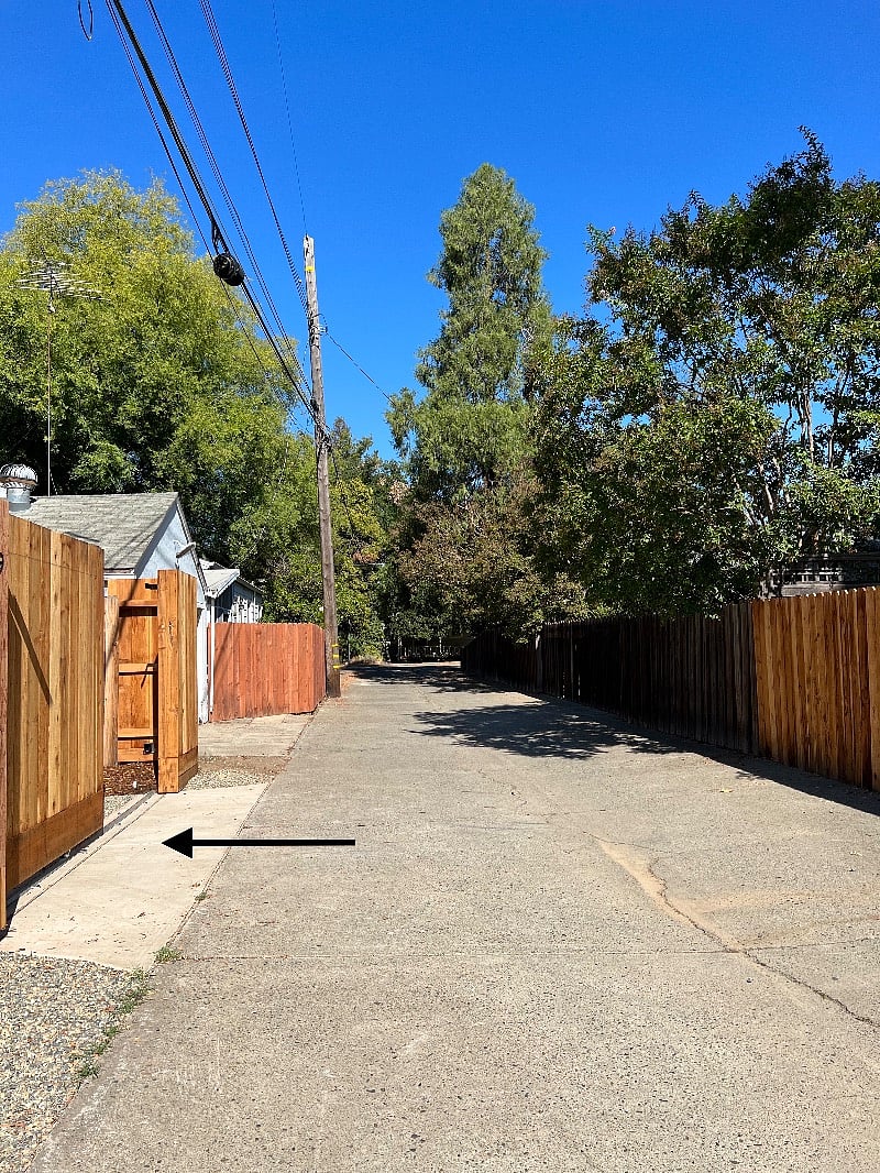 The app-enabled automatic gate is located approx. 100 feet down a maintained alley.
