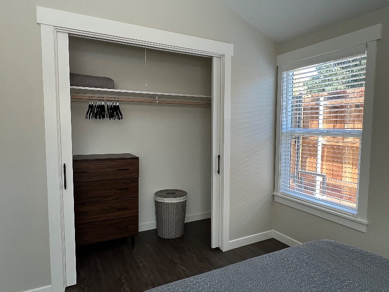 Large closet with pocket doors.