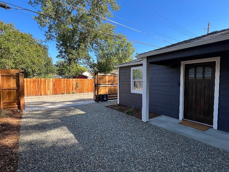 Enter through the app-enabled electric gate. Secure parking is just steps from the front door.
