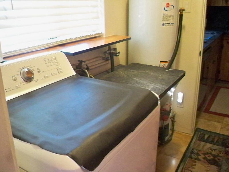 Gas dryer is 2 steps out back door in connected shed