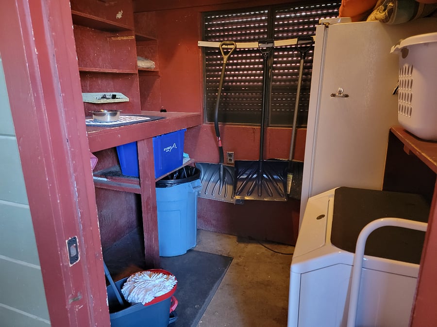 Storage room directly out back door with dryer