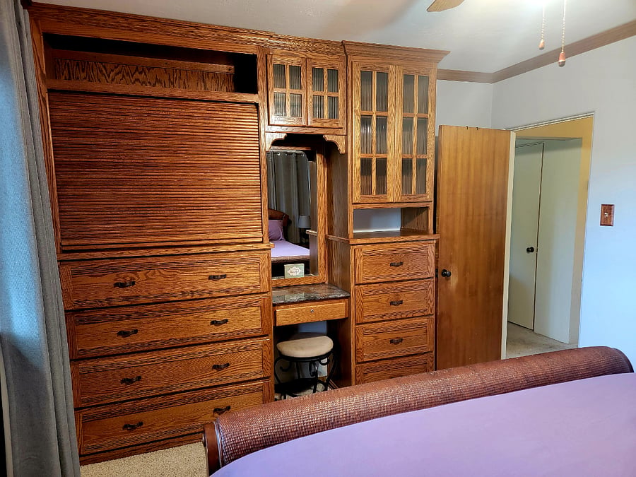 Large built-in dresser/vanity with concealed TV.
