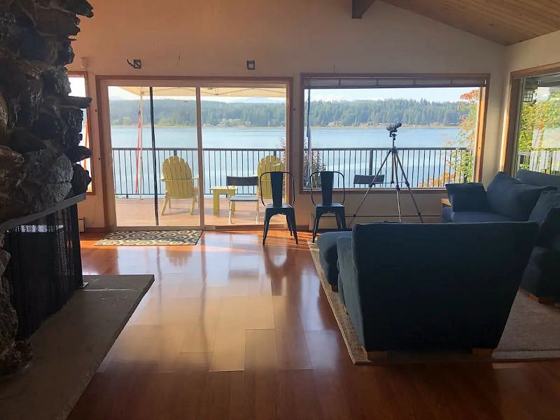 Views from living room with large wood burning fireplace.