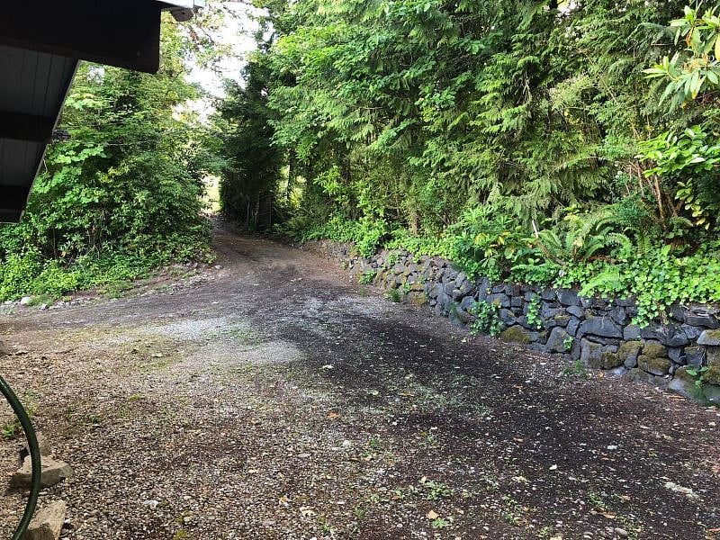 Driveway to the house with secure gate.