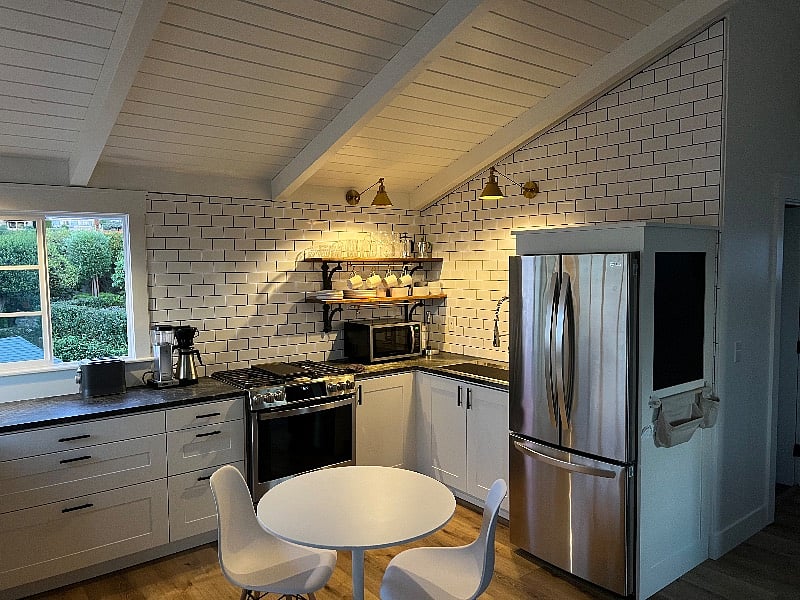Kitchen with GE Profile gas range and full size LG refrigerator