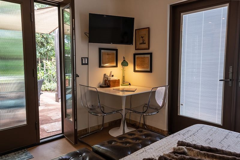 Cozy dining/work table. TV can be adjusted from the wall.