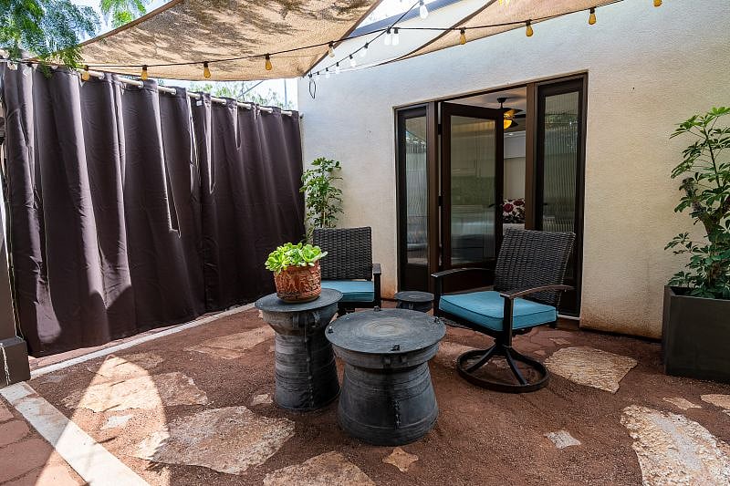 Privacy curtains provide coziness to the patio.