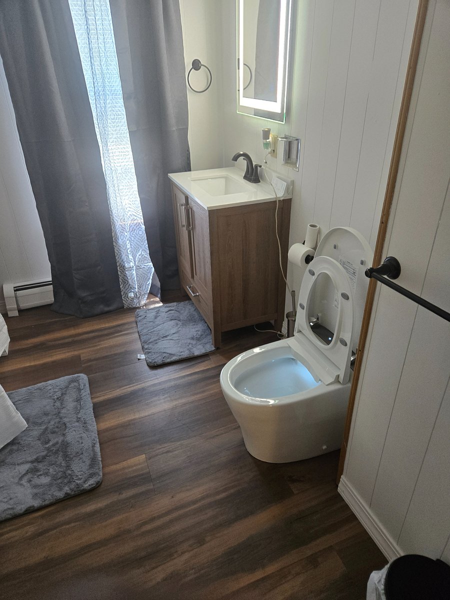 Wash your worries away in a Neat Full bathroom (toilet bidet self cleaning, sink, tub, and shower)