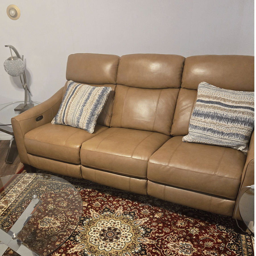 Step into a warm, simple and modern Living room ( with deep Leather Cushioning Mullican Zero Gravity Power Sofa with Power Headrest with soft light on either sides for reading or socializing )