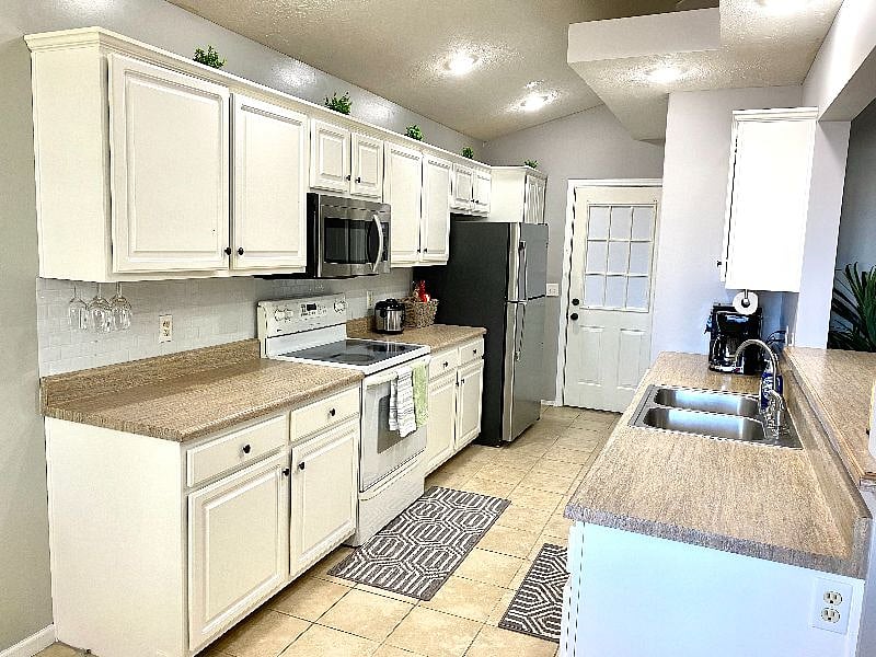 Oneida utensils, Malakasa dishes and cups, wine glasses, basic cookware and utensils, basic bakeware, knives, dish dryer rack and microwave food splatter cover provided.