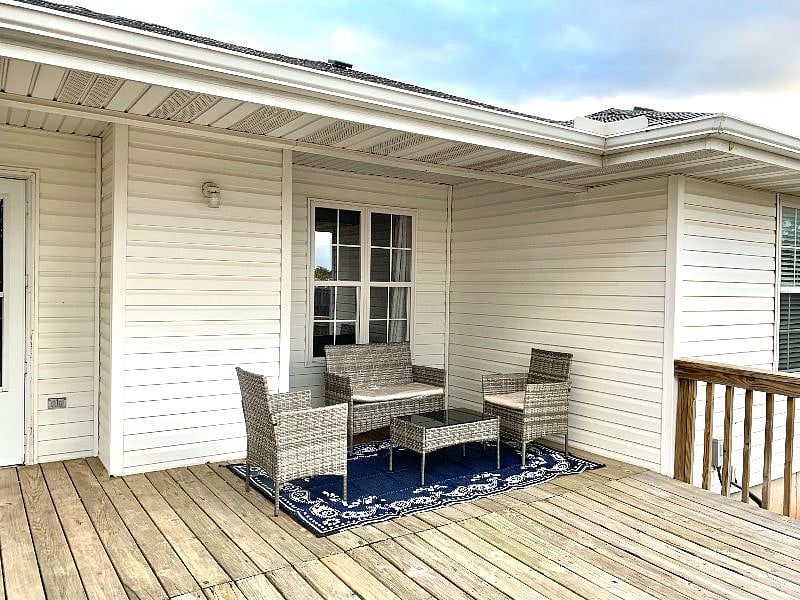 Large patio with brand new patio furniture and small grill.
