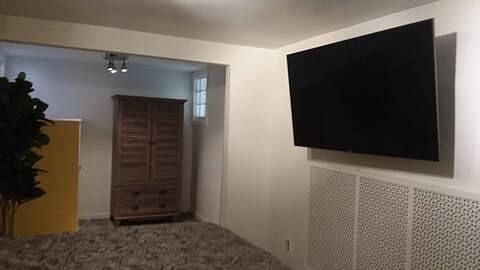 Mounted television and dressing room