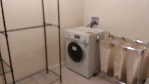 Laundry room with all-in-one washer/dryer