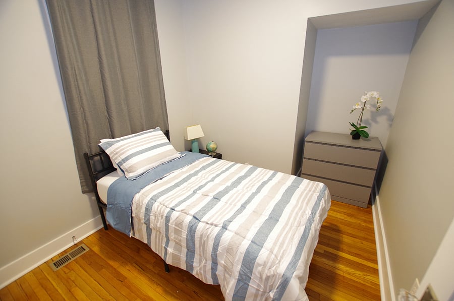 Twin bed with a Zinus 12 inch memory foam mattress with cooling gel foam medium firmness.
