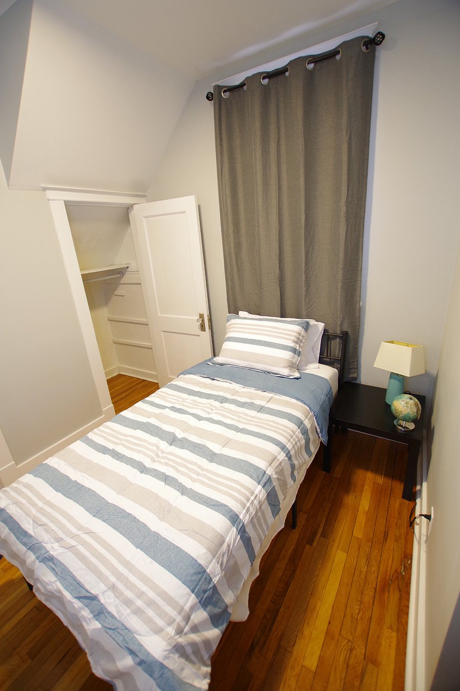 Twin bed with a Zinus 12 inch memory foam mattress with cooling gel foam medium firmness.