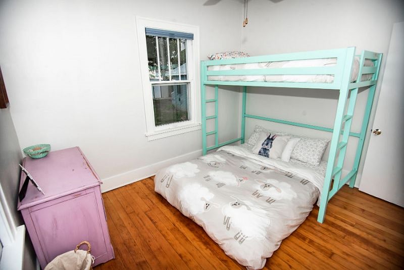 The second bedroom with room for 3 including a locally made Juna mattresses, Queen size below with twin size loft bed