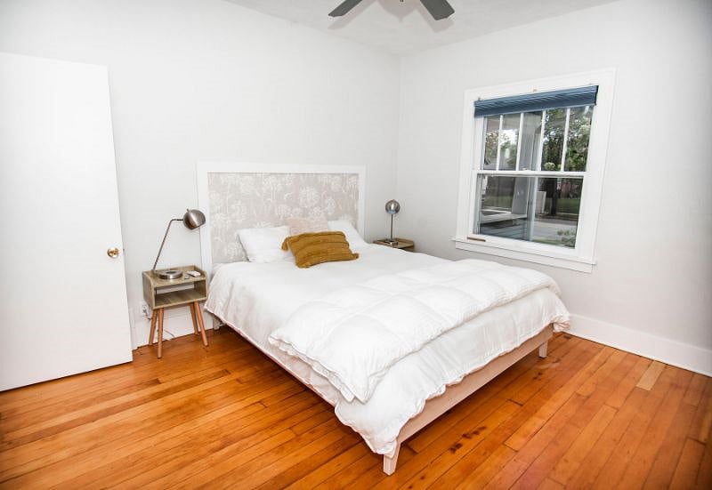 Front bedroom has table side reading lamps including charging ports