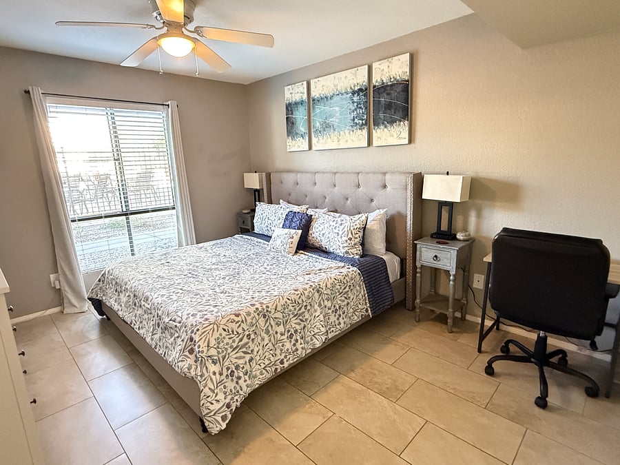 Master Bedroom with King Bed, Desk, Chair, Dresser & TV. Master Bathroom is located right off the bedroom.
