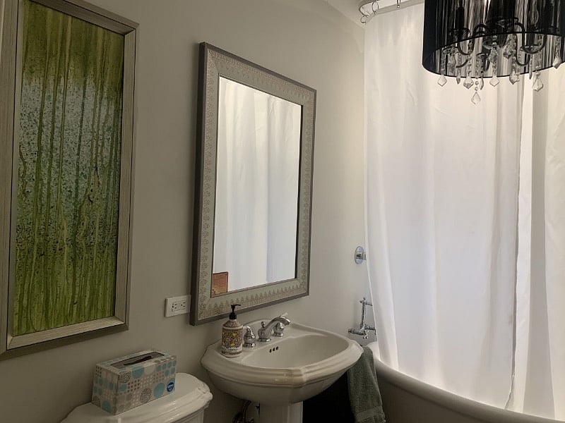 beautiful bathroom with soaking tub and rain shower.