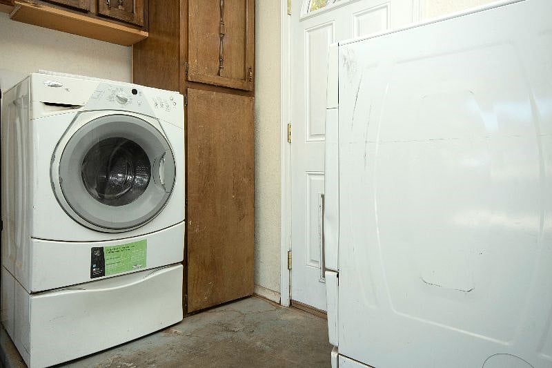 Laundry area with top-notch matching washer & dryer