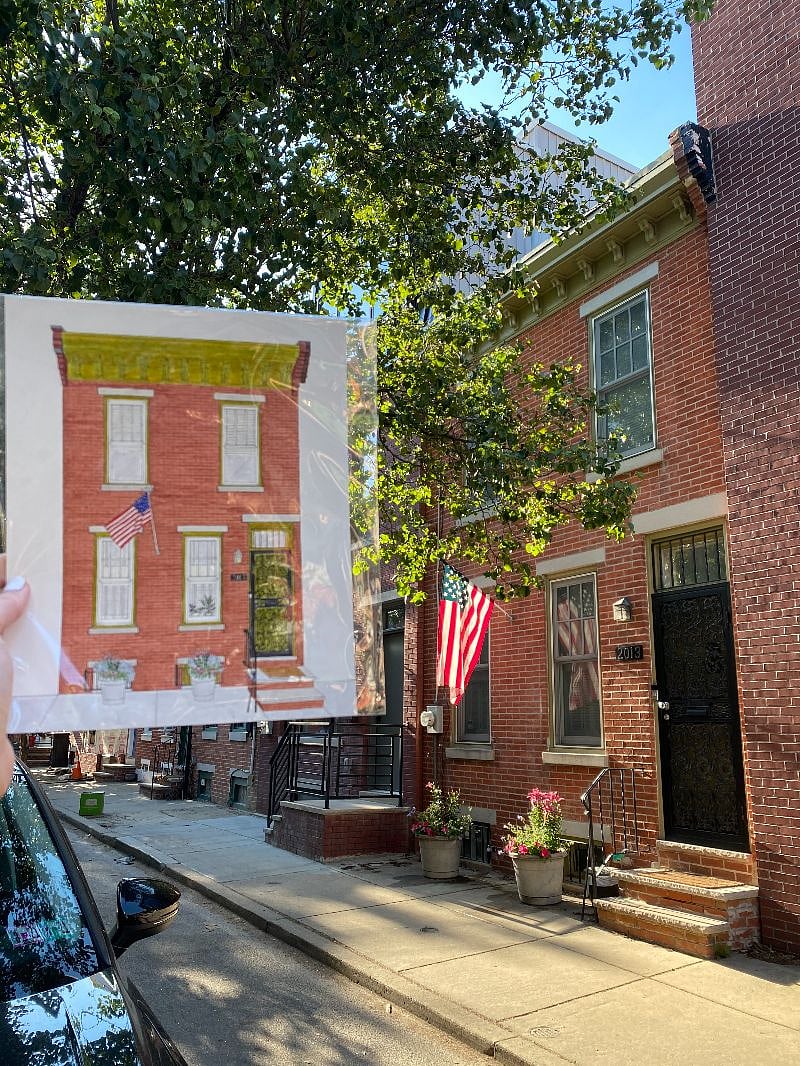 Front of house with drawing by local artist.