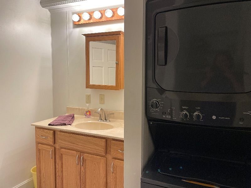 Downstairs shared bathroom with washer/dryer