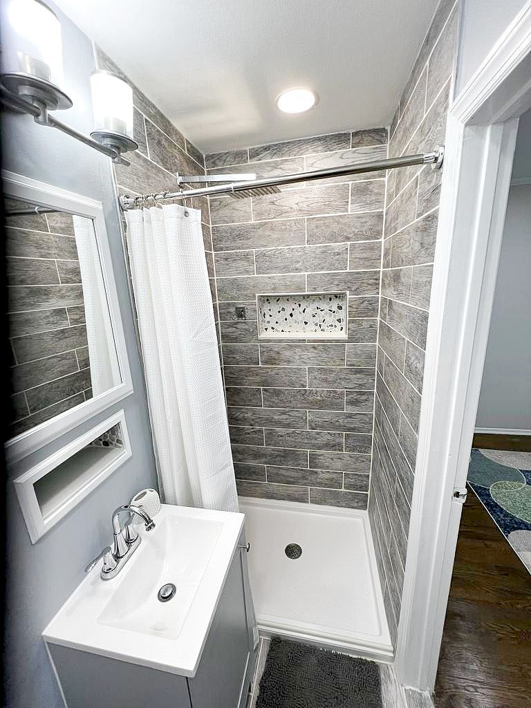 Private bathroom with tiled shower