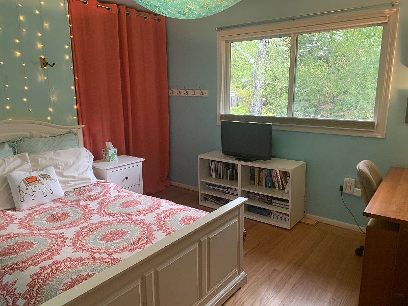 bedroom 3 with view of closet and desk