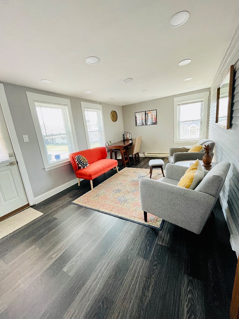 "Bonus" Sun Room. Furnished as an extra "sitting area" or office. This room is bright and sunny all day long.