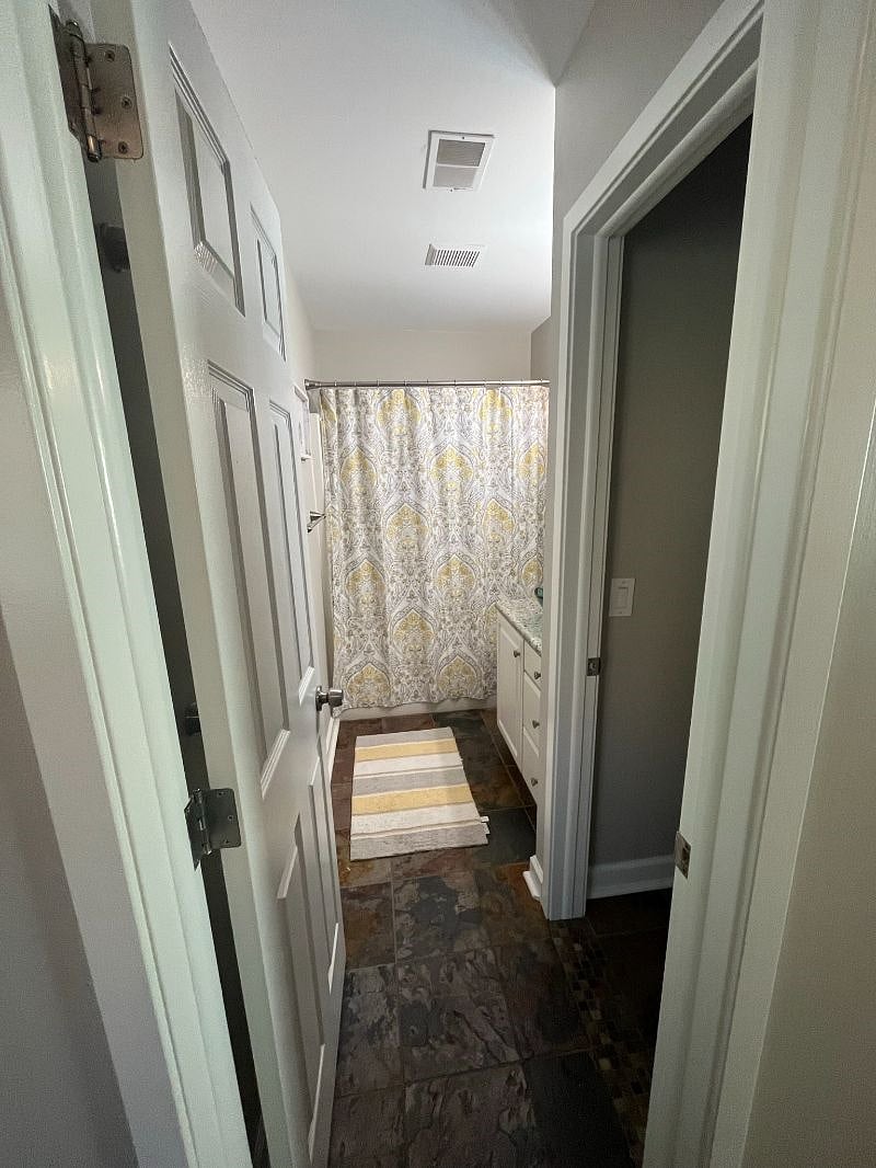 The primary bathroom features a tub/shower and a separate toilet room for privacy.