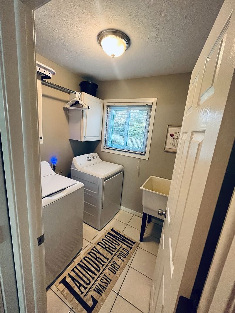 The main level has a laundry room with a full-size washer and dryer.