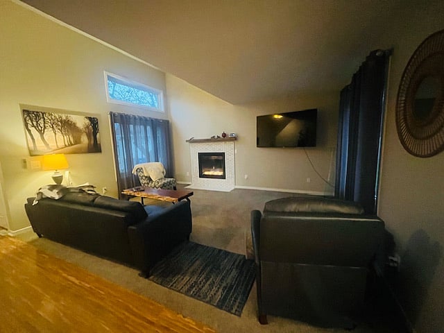 The living room is next to the front door, providing a welcoming entry space.