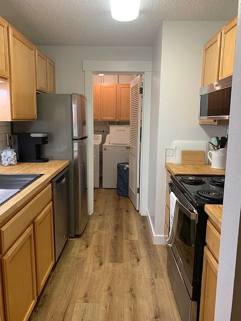 Kitchen with separate laundry room