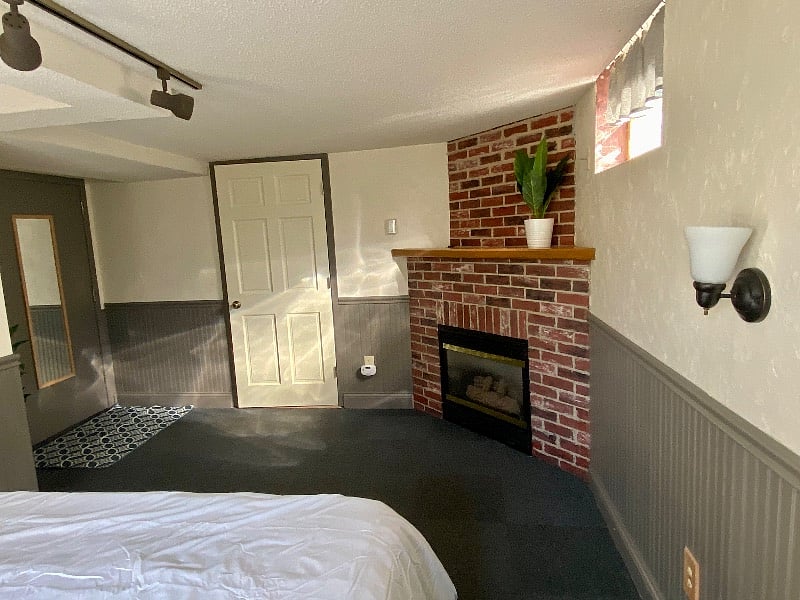 bedroom room with a nice closet and fireplace