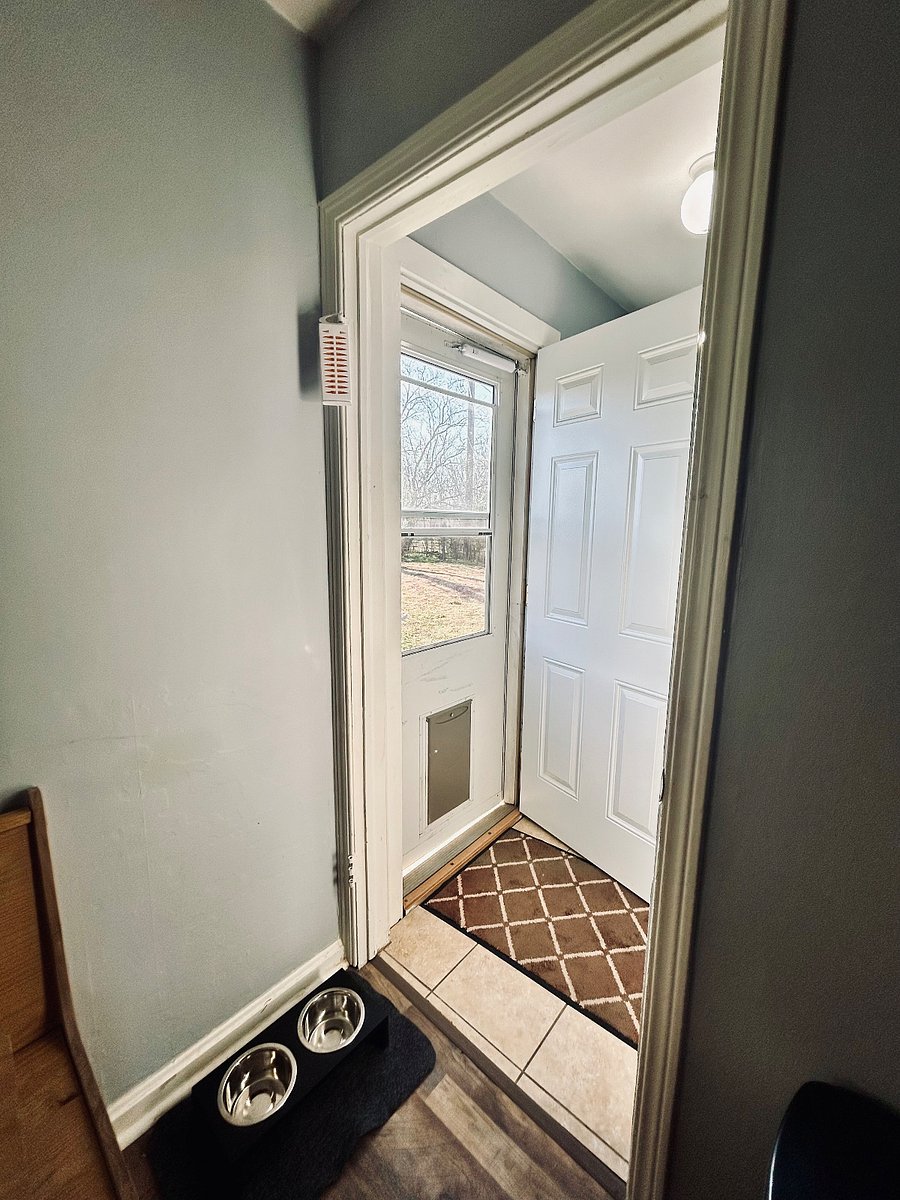 Laundry room, back entrance with doggy door.