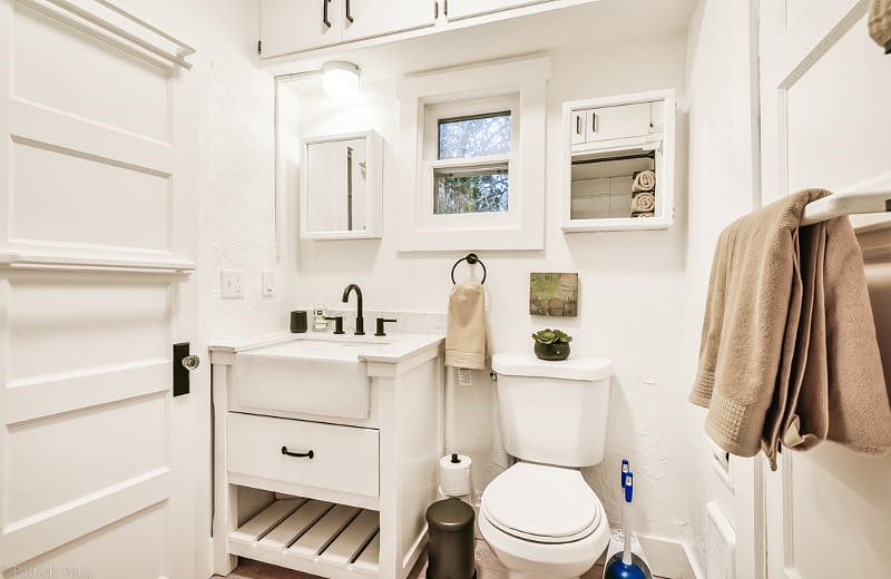 Bathroom has two doors and is accessible from bedroom #1