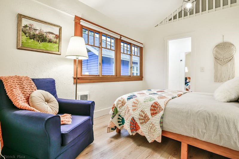 Bedroom #2 with Queen bed, new wooden frame that is solid with a new mattress that is medium to firm, 2 down pillows, 2 non down pillows and down comforter with new cotton linens. Lots of natural light with black out shades for sleeping.