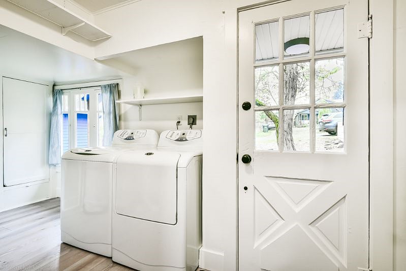 Laundry room with iron/ironing board, detergent, vacuum, broom/dust pan and mop.
Laundry room exits onto a little front porch. Door locks between kitchen and laundry room as well as this front door.