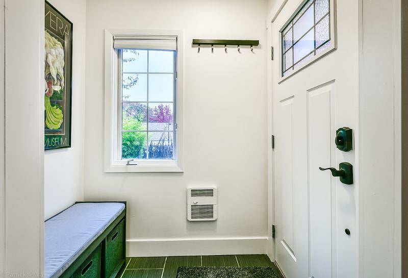 Shoes bin and coat rack upon entry.