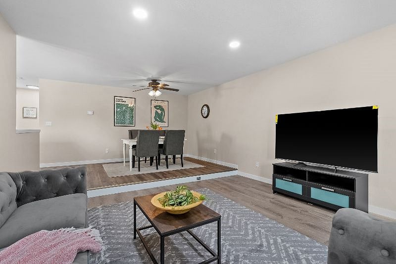 Relax after a long day in front of the 65" Smart TV.