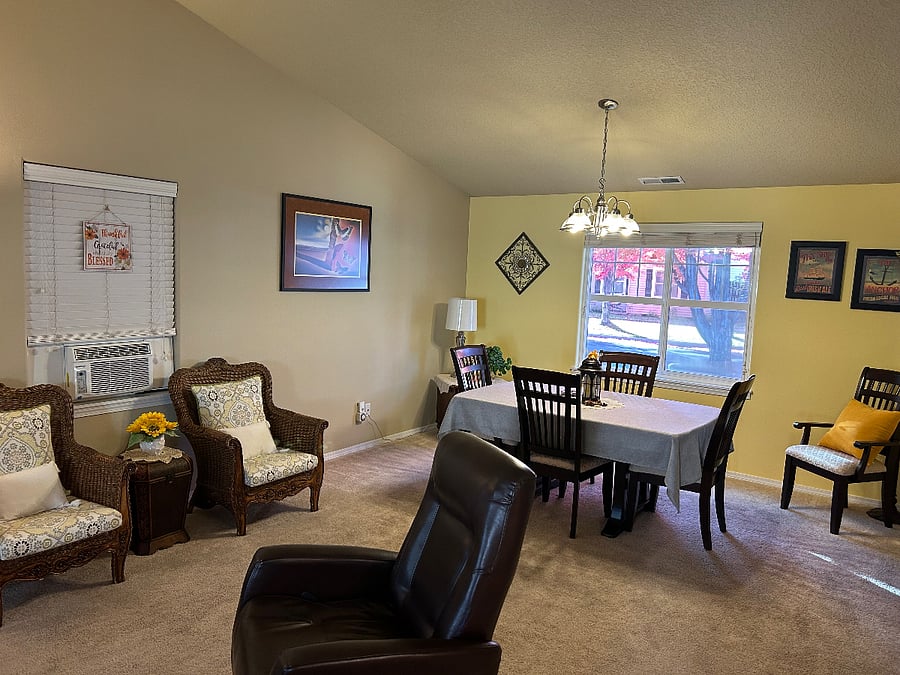 A light and bright open floor plan with dining table.