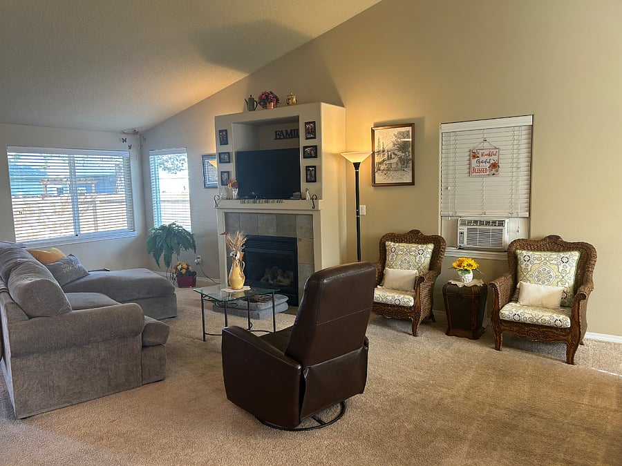 A light and bright common space with open floor plan and a gas fireplace for fall and winter warmth.