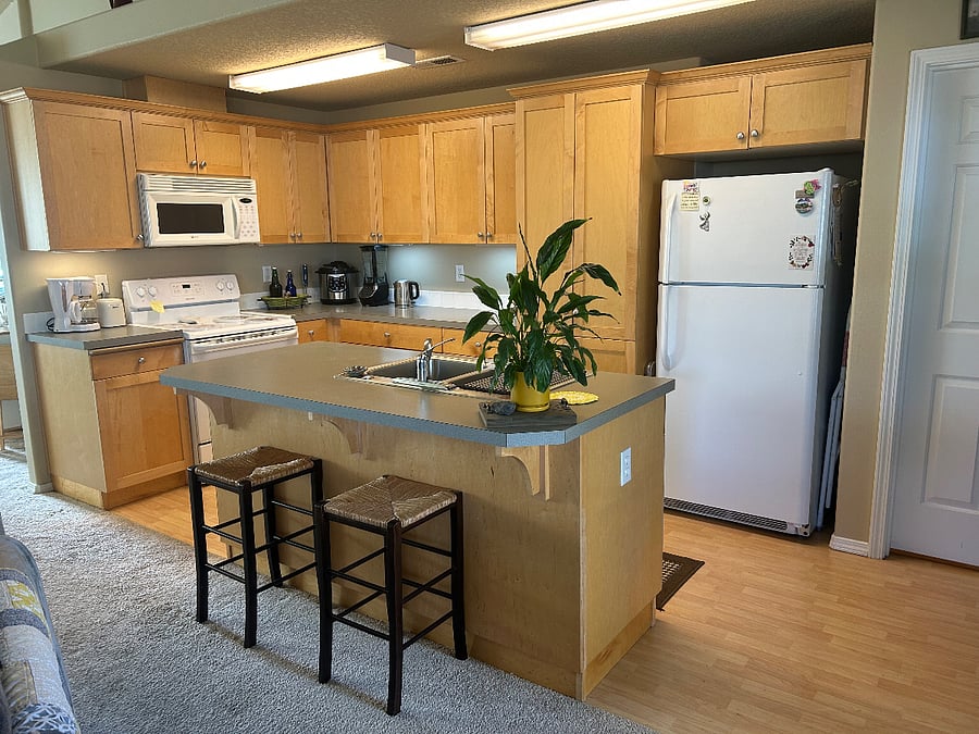 Full Kitchen - microwave, electric stove/oven; dishwasher and an adjacent laundry room with full-size washer and dryer. You'll have your own designated cupboard spaces.